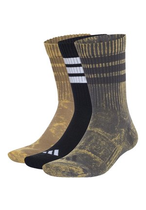 Drei crew-lange Socken in der vorderen Reihe: grau und gelb marmoriert, schwarz mit weißen Streifen und braun mit gelben Marmormustern.