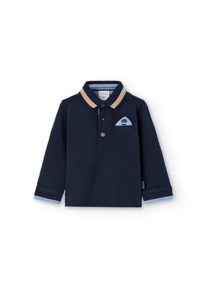 Navy blue long-sleeve polo shirt with beige-striped collar, light blue inner cuffs, and small front pocket with hat and mustache design.