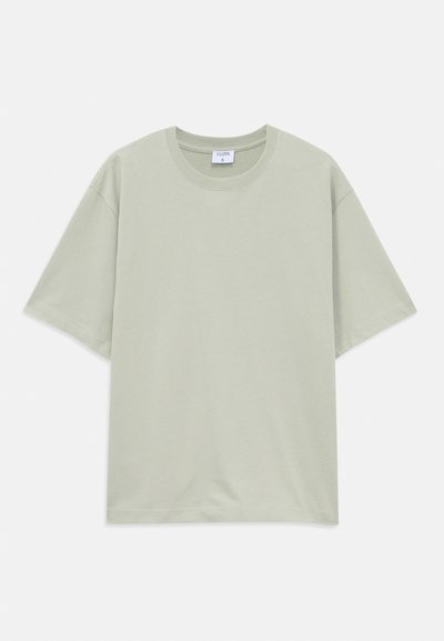 Light green loose-fit short-sleeve cotton T-shirt with round neckline, laid flat on white background.