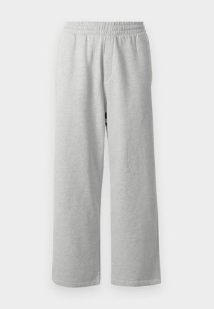 Pantaloni della tuta grigi in cotone con vita elasticizzata e gamba larga, caratterizzati da una texture liscia e un design minimale, adatti per un abbigliamento informale.