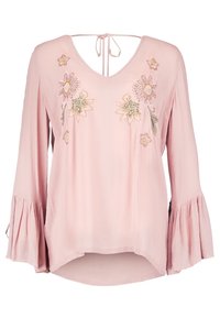 Blusa rosa chiaro con scollo a V e dettaglio con fiocco. Presenta ricami floreali in vari colori. Maniche a campana con finitura testurizzata.