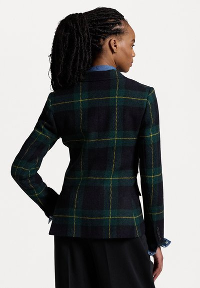 Blazer in lana verde scuro e nero con pattern a quadri gialli. Forma sartoriale con colletto a revers e polsini con bottoni, dotato di uno spacco sul retro.