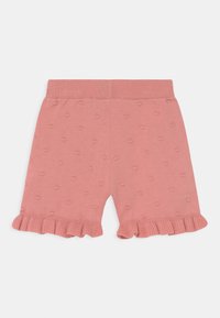 Calções cor-de-rosa feitos de tecido suave, com um padrão de pontos texturizados, cintura elástica e bainha franzida na parte inferior de cada perna.