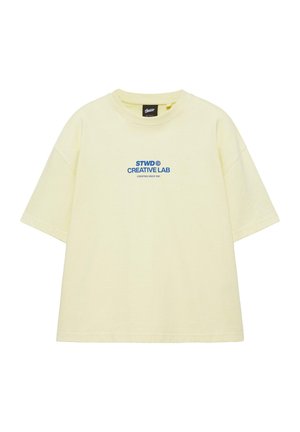 Bledožlté oversized tričko s krátkym rukávom s modrým textom "STWD CREATIVE LAB CREATING SINCE 1991" umiestneným v strede hrudníka.