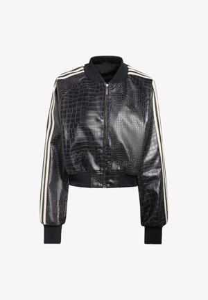 Mustast nahast lühike bomberjakk krokodillinaha tekstuuriga, valgete triipudega varrukatel ning soonikkoes krae ja varrukaservadega.