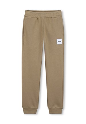 Pantalon de survêtement marron clair fuselé avec taille et poignets élastiques, poches latérales, et un patch blanc portant l'inscription "BOSS" sur la cuisse droite.