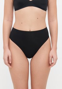 High-waisted black bikini bottom made of smooth fabric. Seamless design with a classic cut, featuring a comfortable waistband and minimalistic style.