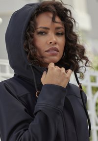 Navy hooded jacket made of smooth fabric, featuring a zipper closure, adjustable drawstrings, and minimalistic design without patterns.