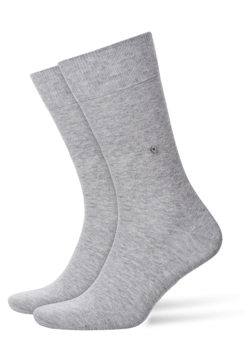 Chaussettes en coton gris avec une texture lisse, un bord côtelé et un petit logo près de la cheville, dotées d'un design à bout arrondi.
