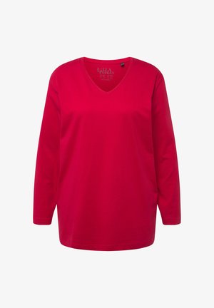 Ilgų rankovių, V-formos iškirptės marškiniai ryškiai raudonos spalvos. Pagaminti iš minkštos medvilnės su lygiu paviršiumi. Turi laisvą prigludimą ir suapvalintą hemą.