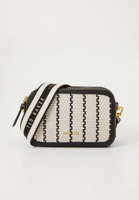 Woven rectangular bag in white with black stripes, black trim, and gold hardware. Adjustable strap with “TED BAKER” printed in black.