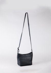 Black leather crossbody bag with a smooth texture, curved top, and adjustable strap. Features a subtle logo and silver hardware accents.