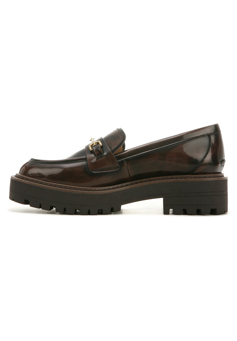 Brown patent leather loafers with a chunky black rubber sole, featuring a decorative gold buckle on the instep and sleek lines.