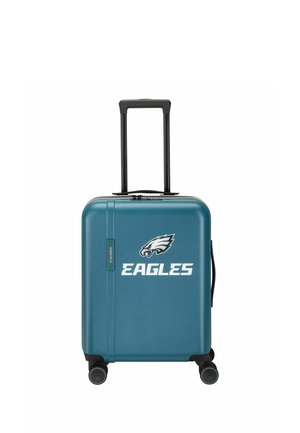 Blauwe harde koffer met zwarte telescopische handgreep en wielen, met wit adelaarlogo en het woord "EAGLES" aan de voorkant.