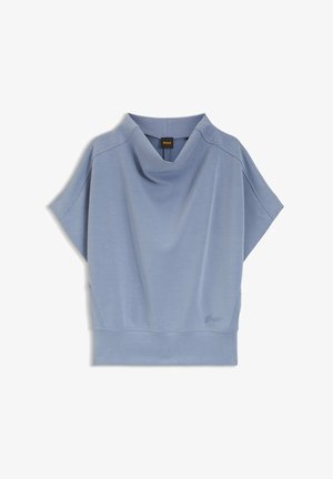 Top de manga corta de color azul claro con escote drapeado, tela suave de mezcla de algodón y detalles sutiles de costura. Presenta un diseño de ajuste relajado.