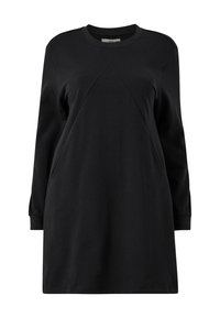 Robe noire à manches longues en coton doux. Dotée d'un col rond, d'une coupe décontractée et de détails de couture diagonale à l'avant.