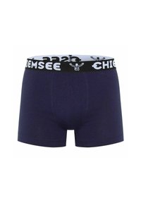 Boxer da uomo blu navy con un cinturino elastico marchiato bianco e nero. Realizzati in materiale morbido e elasticizzato con una texture liscia.
