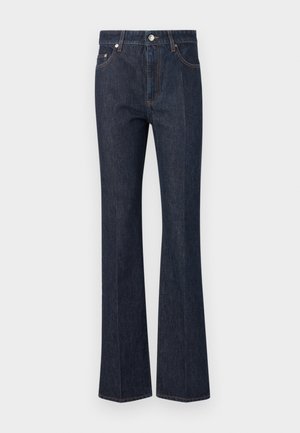 Dark blue denim jeans with a high waist, straight cut, front button closure, and visible stitching on pockets and seams.