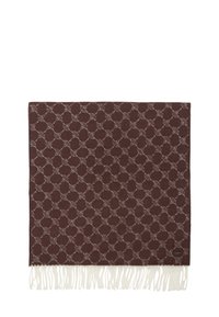 Bruin geweven deken met een cirkelvormig patroon in crème, met franjes aan de randen voor textuur en detail.