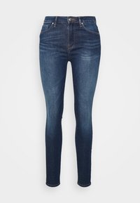 Jeans ajustados en denim azul oscuro, con un clásico diseño de cinco bolsillos, un ligero desgastado y un cierre frontal con botón.