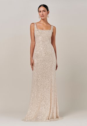Sequined gown in light champagne color with square neckline and thick straps, fitted to the waist, flowing to a straight silhouette at the hem.