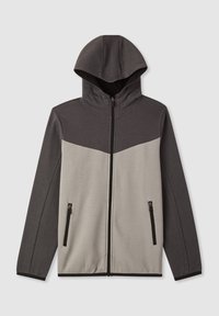 Giacca a zip con cappuccio in grigio scuro e grigio chiaro, caratterizzata da un design a blocchi di colore e due tasche frontali con zip. Tessuto di texture liscia.