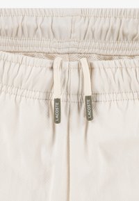 Lacoste GRID TAPED HOODED SET - Treniņtērps - laponie