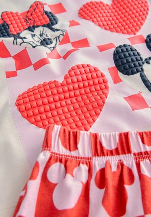 Rood en wit gestreepte stof met verhoogde harten en karaktermotieven, met een gestructureerde elastische taille onderaan de rok.