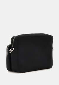 Black zippered bag with a smooth, matte texture, rectangular shape, and silver hardware accents. Compact and versatile design.