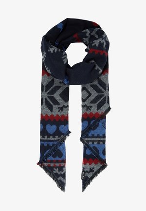 Écharpe bleu foncé avec des motifs de flocons de neige gris, des rayures zigzag rouges et des cœurs bleus, avec des extrémités à franges et une petite étiquette de marque.