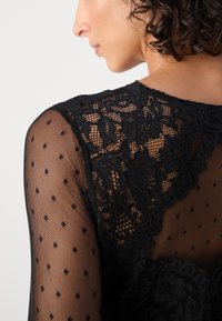 Morgan TIRIVA - Langarmshirt - noir