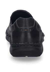 Schwarzer Lederschuh mit abgerundetem Absatz, kontrastierender Naht und Gummisohle. Glatte Textur mit leicht erhobenem Absatz und minimaler Detailgestaltung.