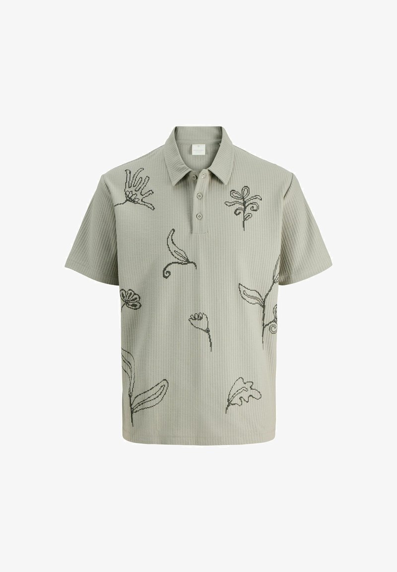 Hellgrünes, geripptes Poloshirt mit gestickten botanischen Designs in Dunkelgrün. Besitzt einen Kragen und drei Knöpfe am Ausschnitt.