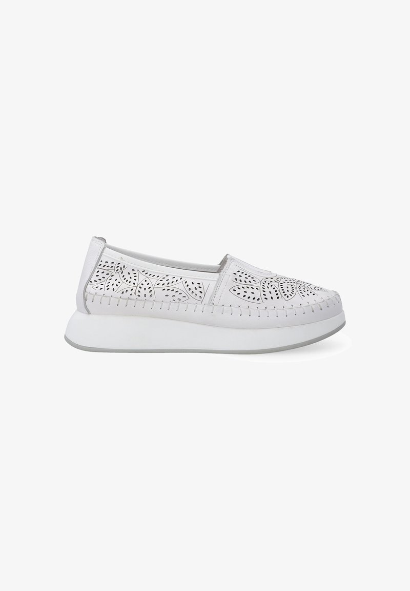 White slip-on shoes featuring perforated floral patterns, a soft upper material, and a thick, lightweight white sole with a grey accent.