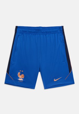 Kék sport rövidnadrág narancssárga részletekkel, hímzett Francia Labdarúgó Szövetség kakas logóval a bal zseb alatt, és narancssárga Nike logó a jobb lábon.