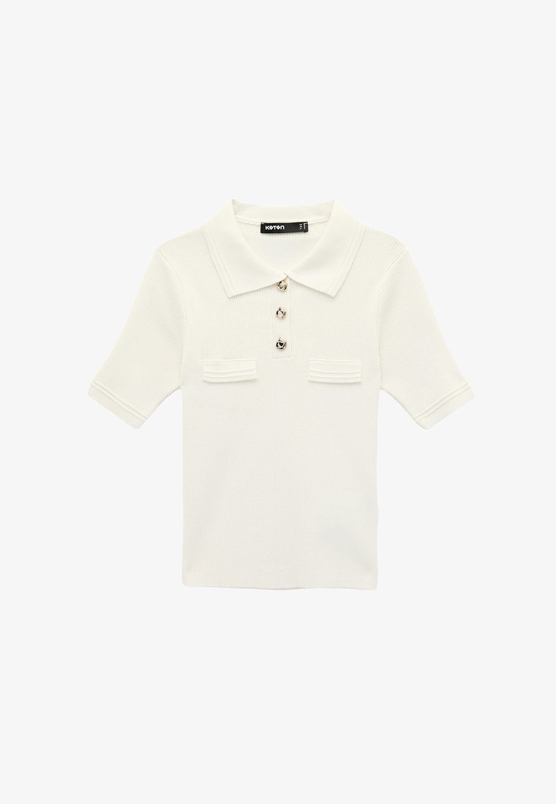 Polo a maniche corte in maglia color crema con colletto, tre bottoni decorativi sul davanti e due piccole tasche sul petto.