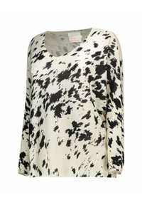 Maglione leggero in maglia crema con motivo astratto a macchie nere, scollo a V ampio e maniche lunghe. Texture morbida e vestibilità comoda.