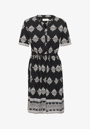 Crna haljina s bijelim cvjetnim uzorkom, kratkim rukavima, gumbima sprijeda, strukom s vezicom i dekorativnim rubom. Izrađena je od lagane tkanine.