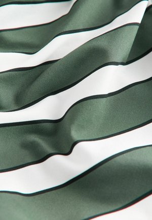 Green and white striped fabric, featuring smooth texture. Stripes are wide with black borders and a gentle wave pattern across the surface.