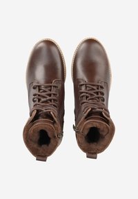 Bottes bottines en cuir marron avec fermeture à lacets, doublure en fausse fourrure et détail zippé. Elles comportent une semelle robuste et des accents cousus autour du bord.