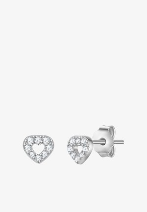 Srebrne kolczyki w kształcie serca z małymi przezroczystymi kryształkami obrysowującymi pusty środek, widoczne z przodu i z boku.