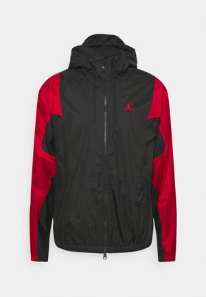 Schwarz-rote Kapuzenjacke mit durchgehendem Frontreißverschluss und rotem Jumpman-Logo auf der linken Brust, langen Ärmeln und Kordelzugkapuze.