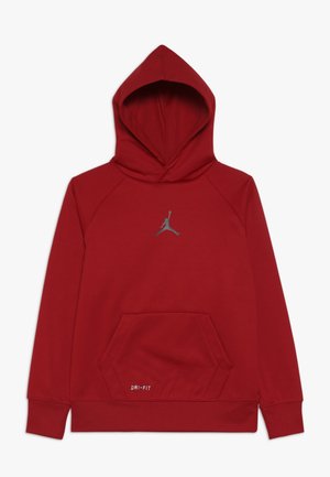 Czerwona bluza z kapturem z kieszenią kangurka z przodu, etykietą Dri-FIT przy kieszeni oraz refleksyjnym logo Jumpman na piersi, pokazana na płasko na białym tle.