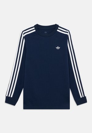 Granatowa koszulka Adidas z długim rękawem, z trzema białymi paskami na rękawach i małym białym logo Trefoil na piersi.