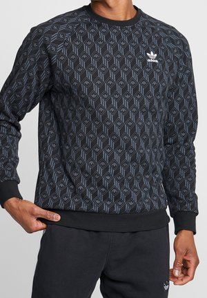 Zwarte sweatshirt met geometrisch patroon en lichtblauwe accenten. Heeft een ronde hals, geribbelde boorden en een Adidas-logo op de borst.