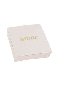 Scatola quadrata di colore rosa pallido con una superficie liscia e angoli arrotondati. La parola "amor" è impressa in oro sulla parte superiore. Design semplice ed elegante.