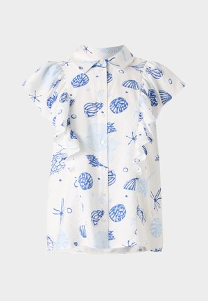 White short-sleeve shirt featuring a blue seashell pattern, button front, and ruffled sleeves. Made from lightweight cotton fabric.