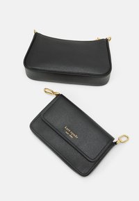 Black leather bag set featuring a textured finish, gold hardware accents, and two different designs: a clutch and a wallet.