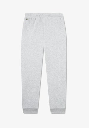 Pantalon de survêtement gris clair en mélange de coton doux, avec des poignets côtelés aux chevilles et un logo brodé à l'arrière. Taille élastique pour plus de confort.