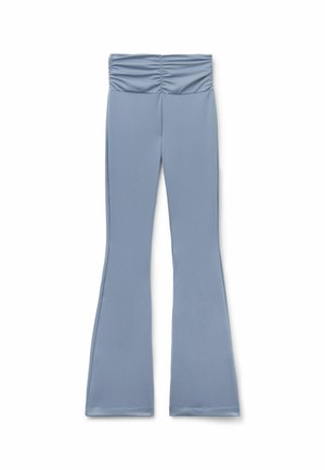 Light blue flared leggings with a gathered waistband, made from a smooth, stretchy fabric, featuring a sleek silhouette and minimal stitching details.